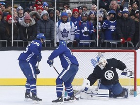 Zamboni driver and sometime Leafs goalie David Ayres makes a save on Zach Hyman at Nathan Phillips Square yesterday. (Jack Boland/Toronto Sun)