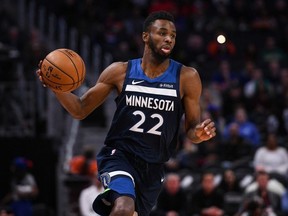 Minnesota Timberwolves guard Andrew Wiggins brings the ball up court during the first quarter against the Detroit Pistons at Little Caesars Arena.