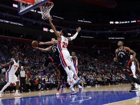 Toronto Raptors guard Fred VanVleet goes to the basket against Detroit Pistons guard Derrick Rose in the first half at Little Caesars Arena.