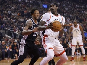 San Antonio Spurs guard DeMar DeRozan defends against Toronto Raptors forward Pascal Siakam during the first half at Scotiabank Arena.