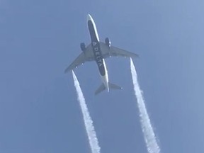 A Delta Airlines, Flight 89, Boeing 777-200 jet empties its fuel tanks as it makes an emergency landing at Los Angeles International Airport, seen from Ocean View Elementary School in Whittier, California, U.S., January 14, 2020 in this still video image obtained by REUTERS.