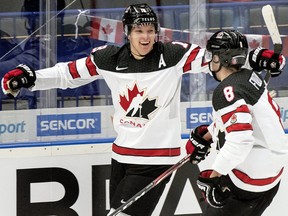 Canada's Ty Dellandrea celebrates with teammate Liam Foudy (8) after scoring against Germany at the World Junior Championship Monday in Ostrava, Czech Republic. (THE CANADIAN PRESS/Ryan Remiorz)