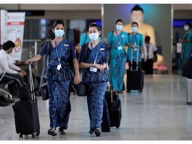 Sri Lankan Airlines staff wear masks at Bandaranaike International Airport after Sri Lanka confirmed the first case of coronavirus in the country, in Katunayake, Sri Lanka January 30, 2020. REUTERS/Dinuka Liyanawatte ORG XMIT: GGGCOL06