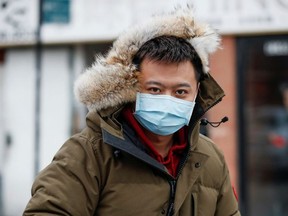 A man wears a masks in Chinatown following the outbreak of a new coronavirus, in Chicago, Illinois, U.S. January 30, 2020.