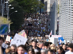 People march in the climate strike march in Montreal, Sept. 27, 2019.