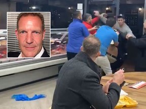 In a viral video, Chris Hill can be seen calmly eating his meal while a brawl erupted in front of him. (LinkedIn, Twitter)