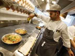 A chef makes a fresh pasta dish at the grand opening of Eataly Toronto grocery store in 2019. (Jack Boland/Toronto Sun/Postmedia Network)