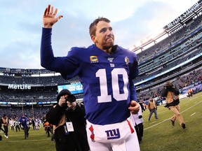 Giants quarterback Eli Manning waves to the crowd after beating the Dolphins at MetLife Stadium in East Rutherford, N.J., on Dec. 15, 2019.