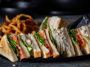 Delicious chicken club sandwich made with  fresh, roasted on premises chicken breast, available at Rock 'N Deli along with a variety of other great deli foods