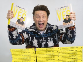 Jamie Oliver and his new book, Ultimate Veg: Easy & Delicious Meals for Everyone. (Stan Behal/Toronto Sun/Postmedia Network)