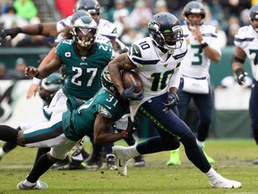 Seattle Seahawks wide receiver Josh Gordon catches the ball and is tackled by Philadelphia Eagles cornerback Jalen Mills during the second quarter at Lincoln Financial Field.