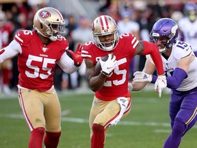 San Francisco 49ers cornerback Richard Sherman (25) intercepts a pass against the Minnesota Vikings in the third quarter in a NFC Divisional Round playoff football game at Levi's Stadium.