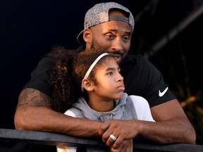 IRVINE, CA - JULY 26:  Kobe Bryant and daughter Gianna Bryant watch during day 2 of the Phillips 66 National Swimming Championships at the Woollett Aquatics Center on July 26, 2018 in Irvine, California.  (Photo by Harry How/Getty Images)