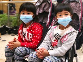 SYDNEY, AUSTRALIA - JANUARY 23: Passengers arrive at Sydney International Airport on January 23, 2020 in Sydney, Australia. The flight from Wuhan departed the Chinese city prior to officials temporarily closing down transport from the city to help stop the outbreak of a strain of coronavirus that has killed 17 people and infected over 500 in places as far away as the United States. Flights, trains and public transport including buses, subway and ferry services have temporarily closed in Wuhan with officials asking residents to stay in town to try and contain the flu-like virus. This week marks the start of Chinese Lunar New Year holiday, the busiest season for Chinese travellers. (Photo by Don Arnold/Getty Images)