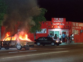 A car buns on NW 54 street in Liberty City area of Miami during Super Bowl Week in 1989. Violence and looting went for days following the shooting of a robbery suspect. The 49ers beat the Bengals in a memorable game.  Getty Images