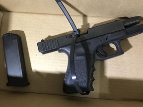 A handgun was seized in connection with last month's deadly shooting of Koshin Yusuf, 26, during the execution of search warrants on Wednesday, Jan. 15, 2020. (Toronto Police handout)