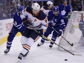 Edmonton Oilers forward Connor McDavid controls the puck against the Toronto Maple Leafs during the second period at Scotiabank Arena.