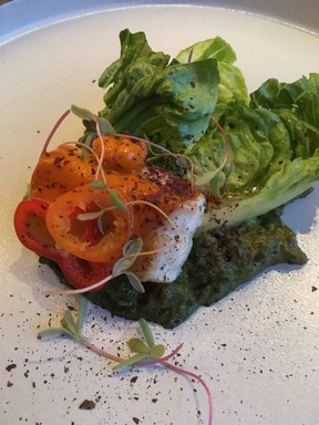 Pan-seared halibut with sea buckthorn and pepper sauce and seaweed and cucumber pesto at Legende in Quebec City.