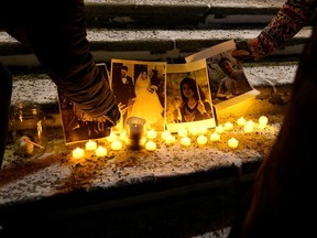 People attend a candlelight vigil held at the Edmonton Legislature building in memory of the victims of a Ukrainian passenger plane that crashed in Iran, in Edmonton, Alberta, Canada, January 8, 2020.