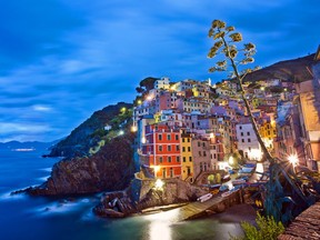 The picture-perfect setting of the Cinque Terre villages (in this case, Riomaggiore) draws millions of tourists annually. (Dominic Arizona Bonuccelli)