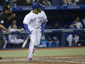 Toronto Blue Jays Vlad Guerrero Jr. 3B hammers a ball in the third inning to the left field corner for an out  in Toronto, Ont. on Friday April 26, 2019. Jack Boland/Toronto Sun/Postmedia Network