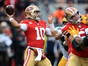 49ers quarterback Jimmy Garoppolo drops back to pass against the Packers during the NFC Championship game at Levi's Stadium in Santa Clara, Calif., on Jan. 19, 2020.