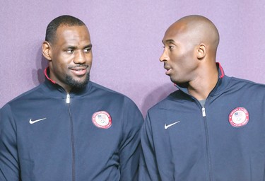 LeBron James (left) and Kobe Bryant (right) look on during a press conference ahead of the London 2012 Olympics on July 27, 2012 in London, England.