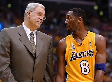 Kobe Bryant (right) of the Lakers talks with coach Phil Jackson in the third quarter of Game 4 of the Western Conference Finals against the Kings at the Staples Center in Los Angeles, on May 26, 2002.