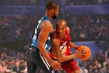 Kobe Bryant, right, of the Lakers and the Western Conference All-Stars looks to move the ball against Dwyane Wade, left, of the Heat and and the Eastern Conference All-Stars during the 2012 NBA All-Star Game at the Amway Center in Orlando, Fla., on Feb. 26, 2012.