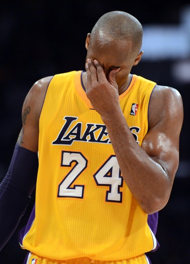 The Lakers' Kobe Bryant wipes off sweat during a game against the Pacers at the Staples Center in Los Angeles, on Nov. 27, 2012.