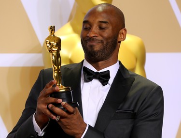 Kobe Bryant shows off the Best Animated Short Film Award for "Dear Basketball" backstage of the 90th Academy Awards in Hollywood, Calif., on March 4, 2018.