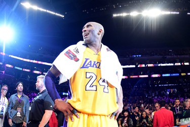 Kobe Bryant of the Lakers celebrates after scoring 60 points in his final NBA game at Staples Center in Los Angeles, on April 13, 2016. The Lakers defeated the Jazz 101-96.