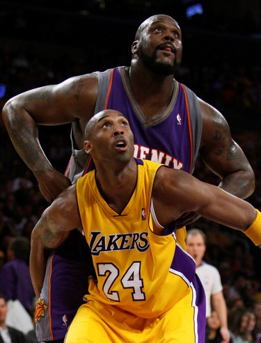 Lakers' Kobe Bryant (24) and Suns' Shaquille O'Neal fight for a rebound during their NBA game in Los Angeles, on Feb. 26, 2009.