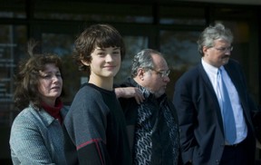 Brendan Butrimas leaves small claims court in Brampton after taking the stand in the opening day of his lawsuit against the Applewood Hockey Association on Oct. 2, 2006. Behind him from left is him mother, Linda Butrimas, legal agent Harry Kopyto, and father Dalius Butrimas. (Ernest Doroszuk/Toronto Sun files)