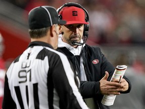 Head coach Kyle Shanahan of the San Francisco 49ers and head linesman Jerry Bergman talk during the game against the Los Angeles Rams at Levi's Stadium on December 21, 2019 in Santa Clara, California. (Thearon W. Henderson/Getty Images)