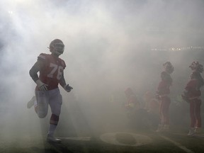 Kansas City Chiefs' Laurent Duvernay-Tardif (76) is introduced before the AFC championship game against the Tennessee Titans Sunday, Jan. 19, 2020, in Kansas City. (AP Photo/Jeff Roberson)