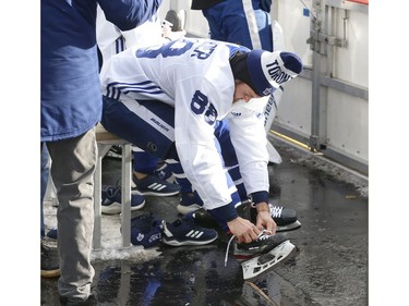 Toronto Maple Leafs held their annual outdoor practice at Nathan Phillips Square (Pictured) William Nylander does his skates on the Leafs bench in Toronto on Thursday January 9, 2020. Jack Boland/Toronto Sun/Postmedia Network