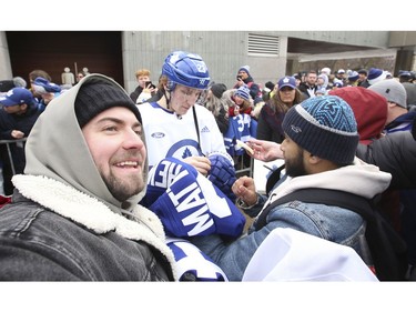 Toronto Maple Leafs held their annual outdoor practice at Nathan Phillips Square (Pictured) Toronto Maple Leafs Travis Dermott signs some autographs after the skate  in Toronto on Thursday January 9, 2020. Jack Boland/Toronto Sun/Postmedia Network