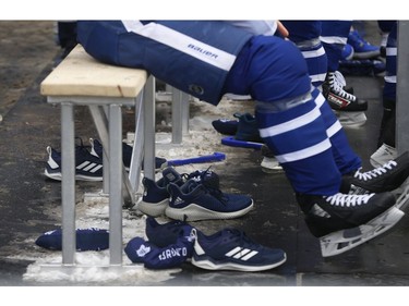 Toronto Maple Leafs held their annual outdoor practice at Nathan Phillips Square (Pictured) Leafs players shoes under Zach Hyman's skates on the makeshift benches   in Toronto on Thursday January 9, 2020. Jack Boland/Toronto Sun/Postmedia Network