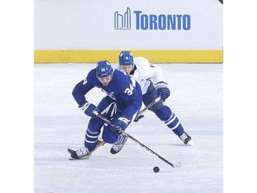 Toronto Maple Leafs held their annual outdoor practice at Nathan Phillips Square (Pictured) Toronto Maple leafs Auston Matthews C (34) is chased down by teammate Zach Hyman (11)  in Toronto on Thursday January 9, 2020. Jack Boland/Toronto Sun/Postmedia Network