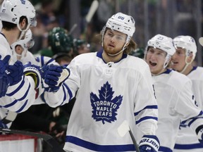 Maple Leafs forward William Nylander is congratulated by teammates after scoring against the Minnesota Wild on Tuesday in St. Paul, Minn. (Andy Clayton-King/The Associated Press)