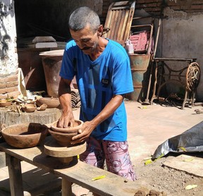 A local artisan makes pottery bowls in his workshop in La Noria.