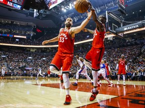 Raptors’ Marc Gasol (left) and Chris Boucher keep the ball inbounds during a late-November game against the 76ers. Gasol is set to retun to the lineup on Wednesday. (Ernest Doroszuk/Toronto Sun Files)