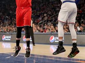 Raptors’ Marc Gasol (left) takes a shot as Knicks’ Taj Gibson defends on Friday night in New York. (GETTY IMAGES)