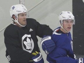 Former Maple Leafs teammates Ron Hainsey (left) and Mitch Marner are now opponents, as Hainsey plays for the Ottawa Senators. (JACK BOLAND/Toronto Sun files)