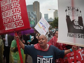 Demonstrators fighting for a $15-per-hour minimum wage march through downtown Chicago during rush hour on May 23, 2017.