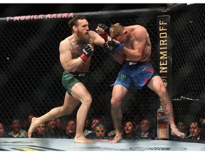 January 18, 2020; Las Vegas, Nevada, USA; Conor McGregor moves in for a hit against Donald Cerrone during UFC 246 at T-Mobile Arena. Mandatory Credit: Mark J. Rebilas-USA TODAY Sports ORG XMIT: USATSI-422802