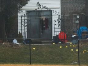 Police markers at the scene of a fatal shooting at a townhouse at 367 Military Tr., in Scarborough, on Saturday, Jan. 12, 2020. (Jack Boland/Toronto Sun/Postmedia Network)