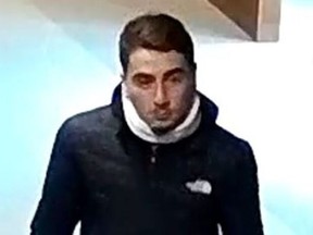 An image released by Toronto Police of a man wanted in the robbery of a Canada Post worker on Nov. 22, 2019.