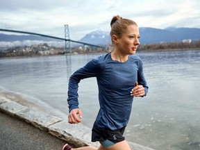 Canadian marathon runner Rachel Cliff runs by the Stanley Park seawall in Vancouver, British Columbia, Canada March 15, 2019.